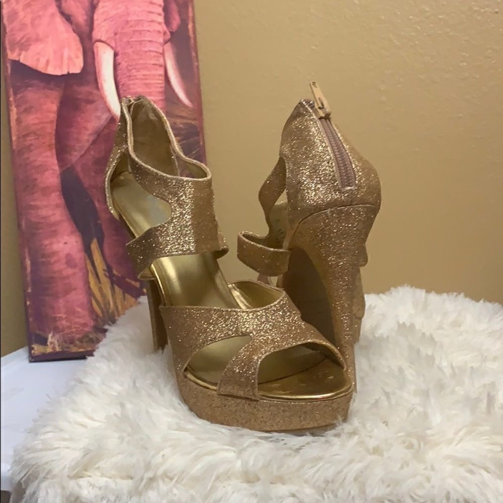 Shiny gold heels  